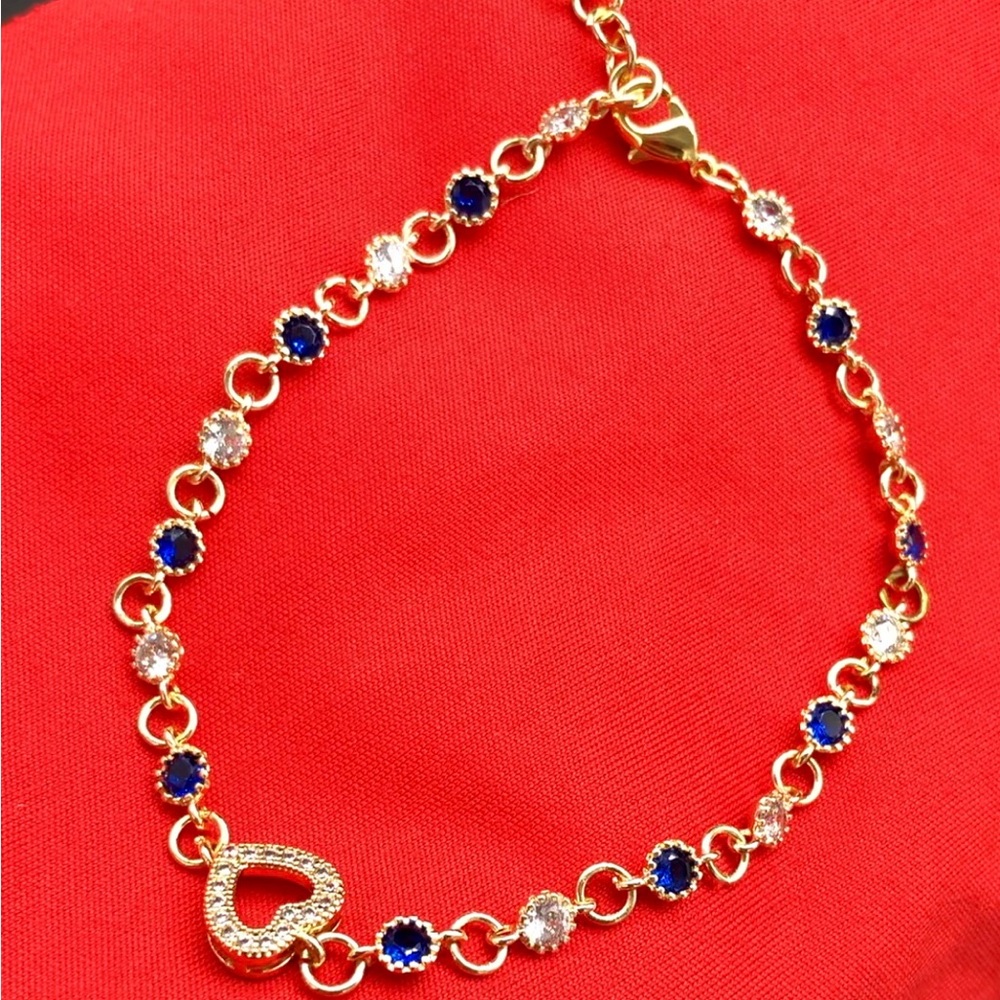 Elegant 18K gold plated bracelet,blue/clear beads, heart charm. 7.5”-8.25”.NWOT.